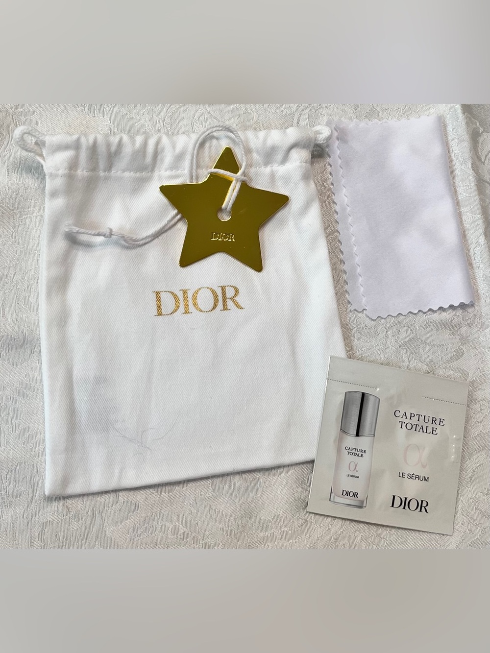 Dior Gold Star Charm, Dior Drawstring Pouch, Cleaning Cloth and Serum Sample